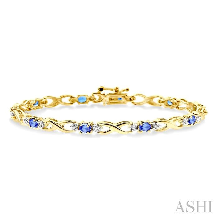 4x3mm Oval Cut Tanzanite and 1/10 Ctw Round Cut Diamond Bracelet in 10K Yellow Gold