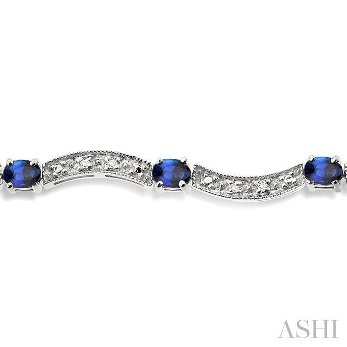 4x3 MM Oval Cut Sapphire and 1/10 Ctw Round Cut Diamond Bracelet in 14K White Gold