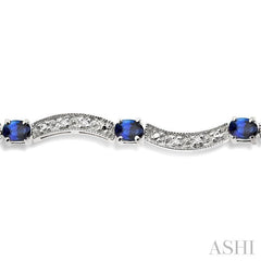 4x3 MM Oval Cut Sapphire and 1/10 Ctw Round Cut Diamond Bracelet in 14K White Gold