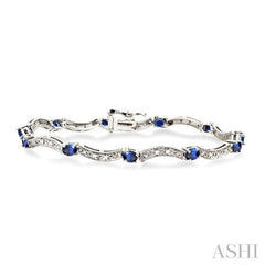 4x3 MM Oval Cut Sapphire and 1/10 Ctw Round Cut Diamond Bracelet in 14K White Gold