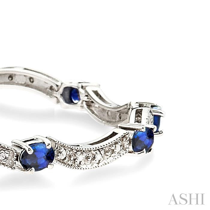 4x3 MM Oval Cut Sapphire and 1/10 Ctw Round Cut Diamond Bracelet in 14K White Gold