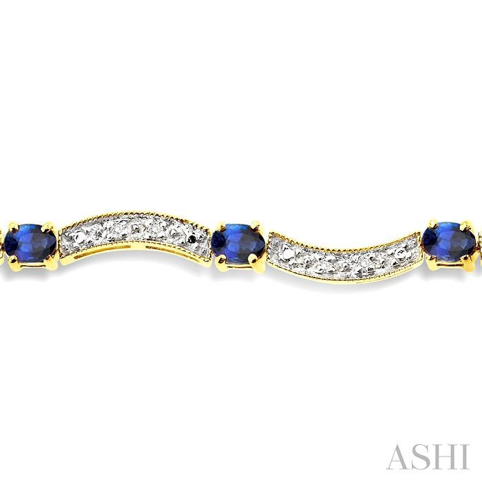 4x3 MM Oval Cut Sapphire and 1/10 Ctw Round Cut Diamond Bracelet in 14K Yellow Gold