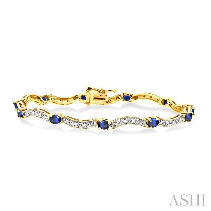 4x3 MM Oval Cut Sapphire and 1/10 ctw Single Cut Diamond Bracelet in 14K Yellow Gold
