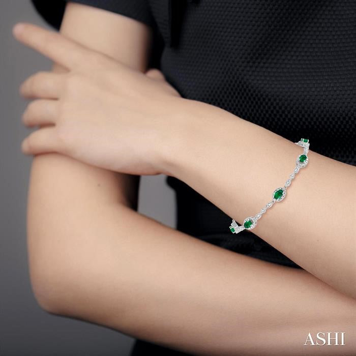 5x3 MM Oval Cut Emerald and 1/20 Ctw Round Cut Diamond Bracelet in 10K White Gold