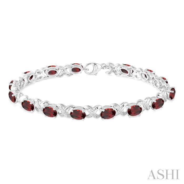 7x5 MM Oval Cut Garnet and 1/20 Ctw Round Cut Diamond Fashion Bracelet in Sterling Silver