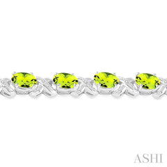 7x5 MM Oval Cut Peridot and 1/20 Ctw Round Cut Diamond Fashion Bracelet in Sterling Silver
