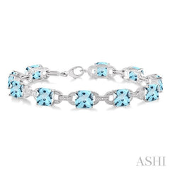 7x7 MM Cushion Shape Blue Topaz and 1/20 Ctw Round Cut Diamond Fashion Bracelet in Sterling Silver