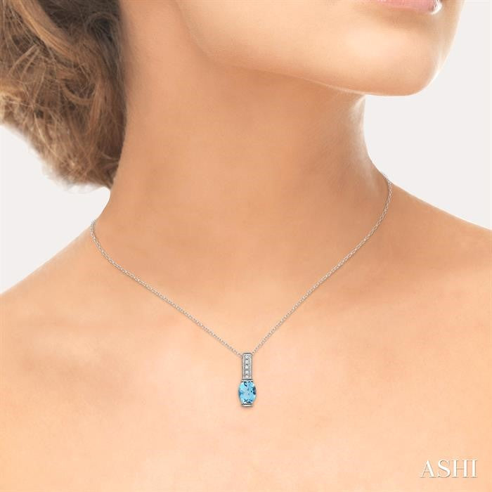 8x6 MM Oval Cut Blue Topaz and 1/50 Ctw Round Cut Diamond Pendant in Sterling Silver with Chain