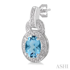 8x6 MM Oval Cut Blue Topaz and 1/20 Ctw Round Cut Diamond Earrings in Sterling Silver