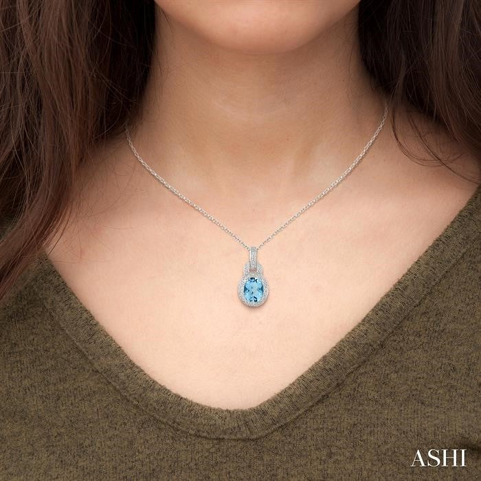 9x7 MM Oval Cut Blue Topaz and 1/20 Ctw Round Cut Diamond Pendant in Sterling Silver with Chain