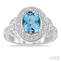 9x7 MM Oval Cut Blue Topaz and 1/20 Ctw Round Cut Diamond Ring in Sterling Silver