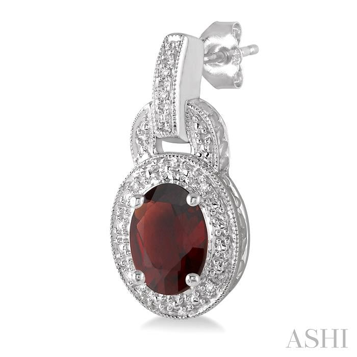 8x6 MM Oval Cut Garnet and 1/20 Ctw Round Cut Diamond Earrings in Sterling Silver