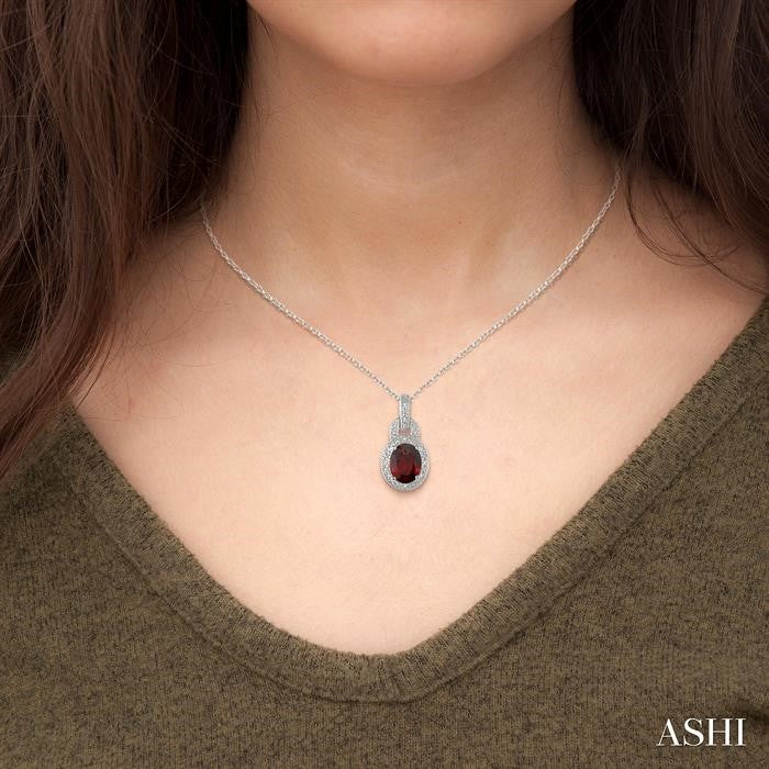 9x7 MM Oval Cut Garnet and 1/20 Ctw Round Cut Diamond Pendant in Sterling Silver with Chain