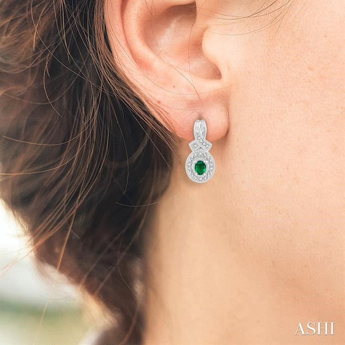 4x3 MM Oval Cut Emerald and 1/20 Ctw Round Cut Diamond Earrings in Sterling Silver
