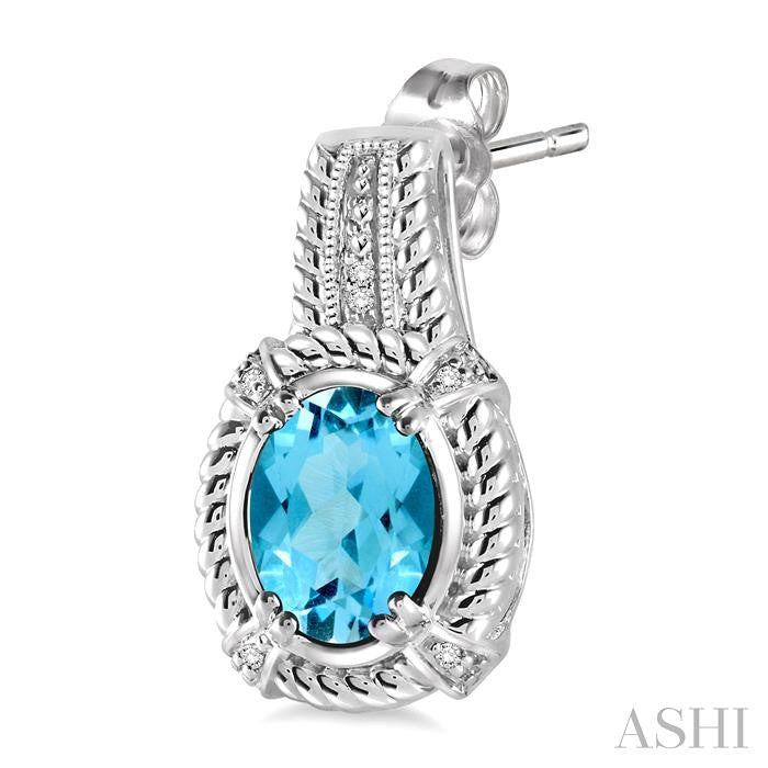 8x6 MM Oval Cut Blue Topaz and 1/20 Ctw Round Cut Diamond Earrings in Sterling Silver