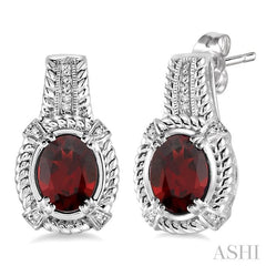 8x6 MM Oval Cut Garnet and 1/20 Ctw Round Cut Diamond Earrings in Sterling Silver