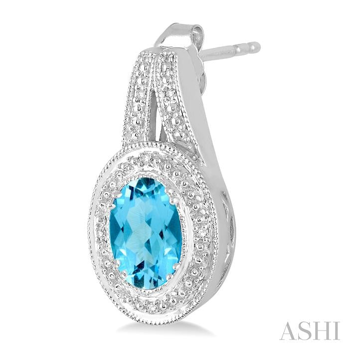 8x6 MM Oval Cut Blue Topaz a and 1/20 Ctw Round Cut Diamond Earrings in Sterling Silver
