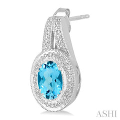 8x6 MM Oval Cut Blue Topaz a and 1/20 Ctw Round Cut Diamond Earrings in Sterling Silver