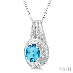 9x7 MM Oval Cut Blue Topaz a and 1/20 Ctw Round Cut Diamond Pendant in Sterling Silver with Chain