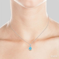9x7 MM Oval Cut Blue Topaz a and 1/20 Ctw Round Cut Diamond Pendant in Sterling Silver with Chain