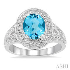9x7 MM Oval Cut Blue Topaz a and 1/20 Ctw Round Cut Diamond Ring in Sterling Silver