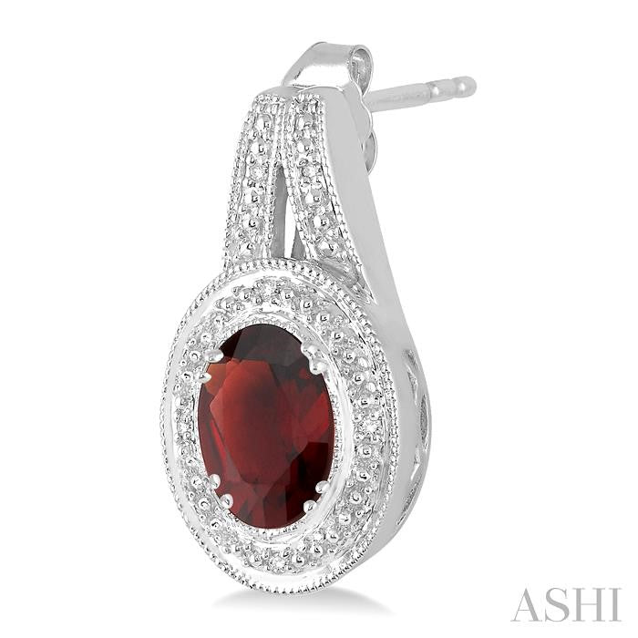 8x6 MM Oval Cut Garnet and 1/20 Ctw Round Cut Diamond Earrings in Sterling Silver