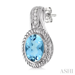 9x7 MM Oval Cut Blue Topaz and 1/20 Ctw Round Cut Diamond Earrings in Sterling Silver