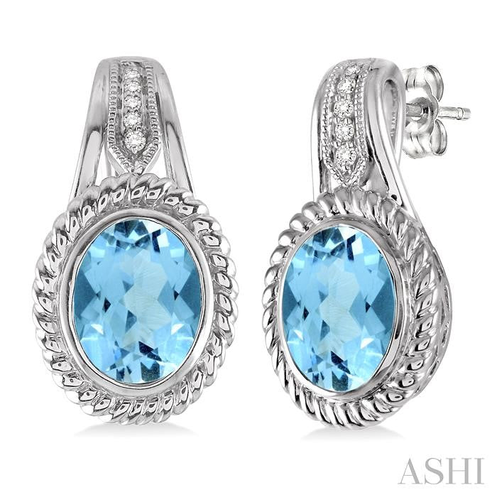 9x7 MM Oval Cut Blue Topaz and 1/20 Ctw Round Cut Diamond Earrings in Sterling Silver