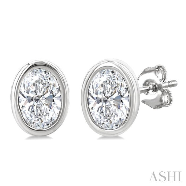 1/5 Ctw Petite Bezel Set Oval Cut Diamond Fashion Stud Earrings in 10K White Gold