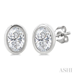 1/5 Ctw Petite Bezel Set Oval Cut Diamond Fashion Stud Earrings in 10K White Gold